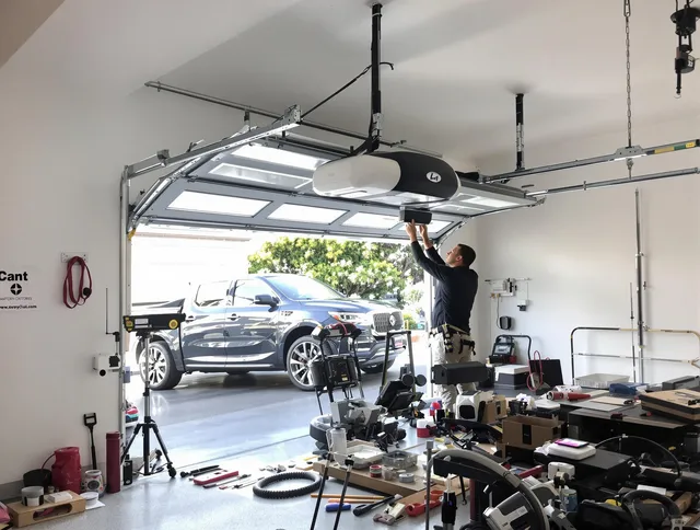 Garden City Garage Door Repair specialist installing smart garage door opener system in Garden City home