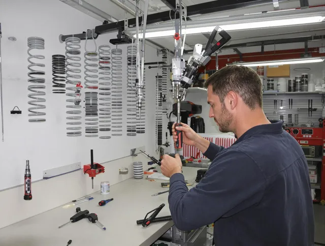Garden City Garage Door Repair safety certified technician performing precision spring replacement in Garden City