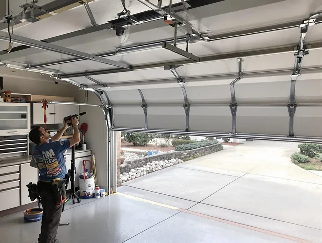 Garage door track repair service by Garden City Garage Door Repair in Garden City